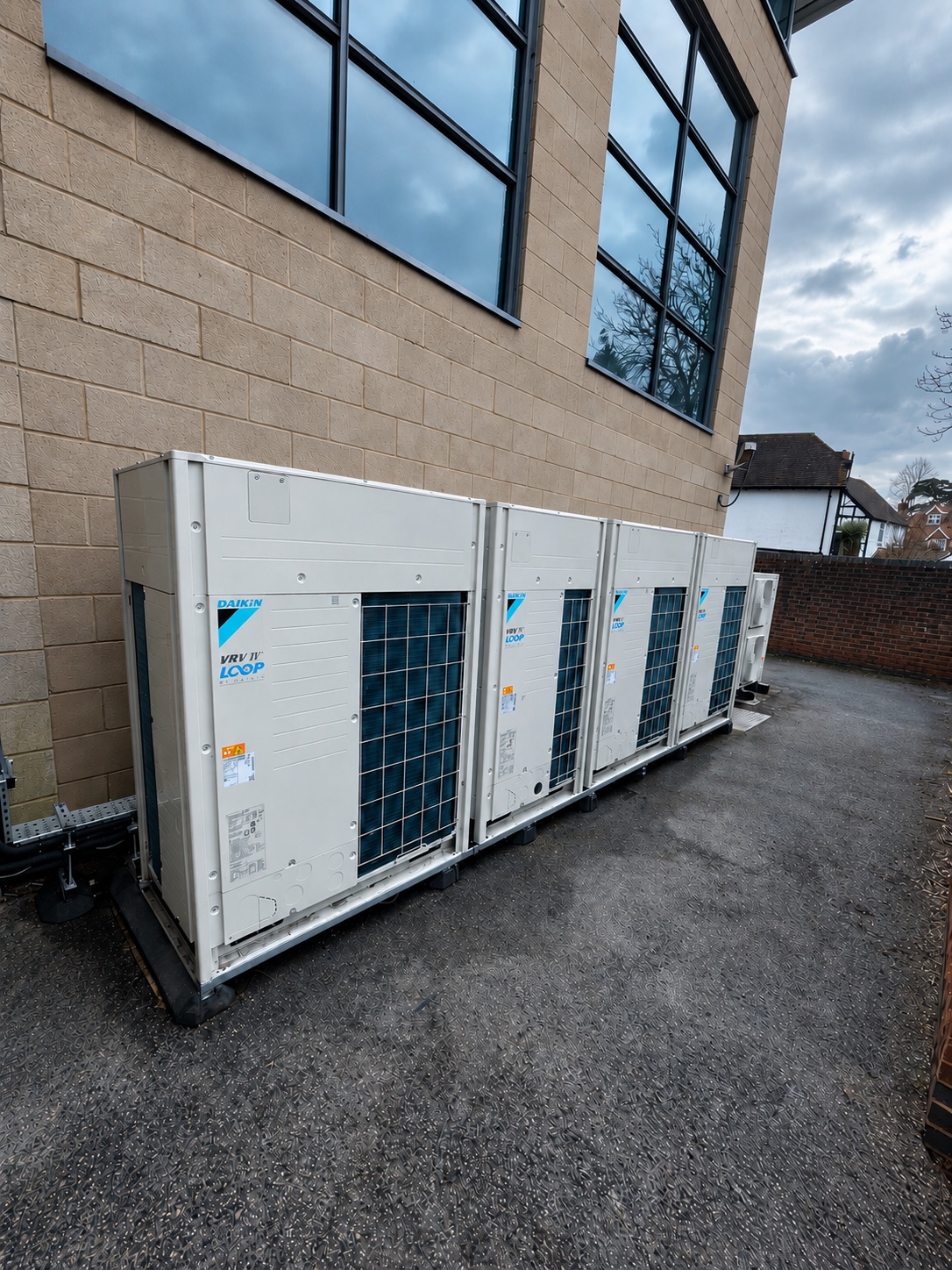 Daikin outdoor air conditioning systems installed alongside a commercial building